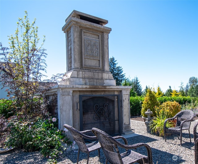 view of patio / terrace with an outdoor fireplace