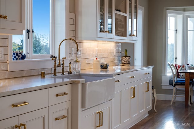 35222 NE 92nd Ave, La Center, WA 98629 - kitchen with a sink, white cabinetry, backsplash, and wood finished floors