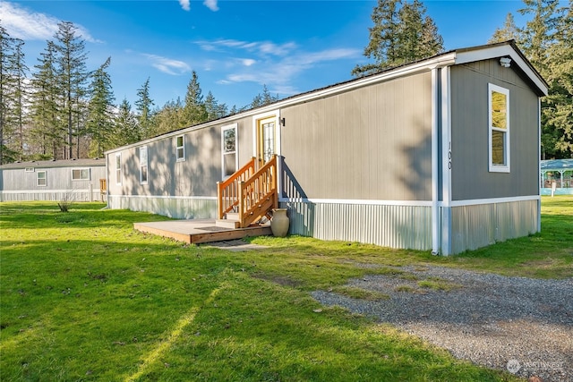 back of house with a yard