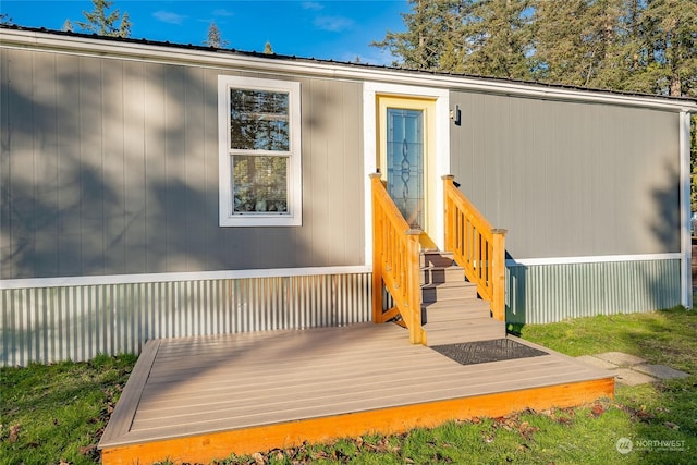 doorway to property featuring a deck