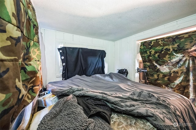 bedroom featuring a textured ceiling