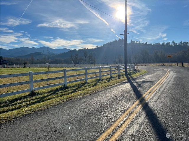 view of road with a mountain view and a rural view