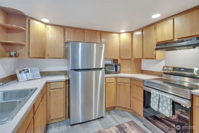 kitchen featuring exhaust hood, sink, light brown cabinetry, light hardwood / wood-style floors, and stainless steel appliances