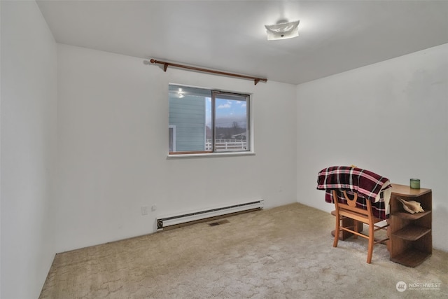 living area featuring light carpet and baseboard heating