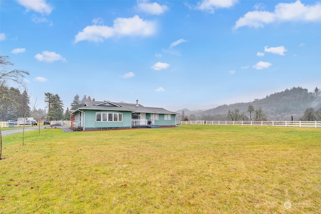 view of yard with a rural view