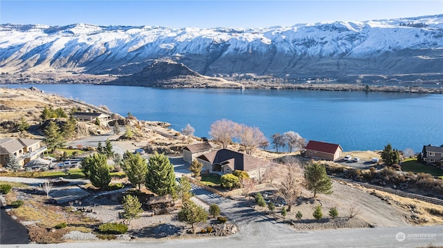 aerial view featuring a water and mountain view