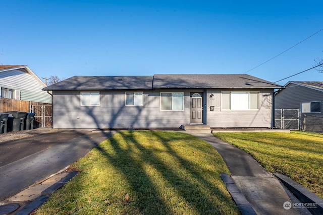 ranch-style home with a front yard