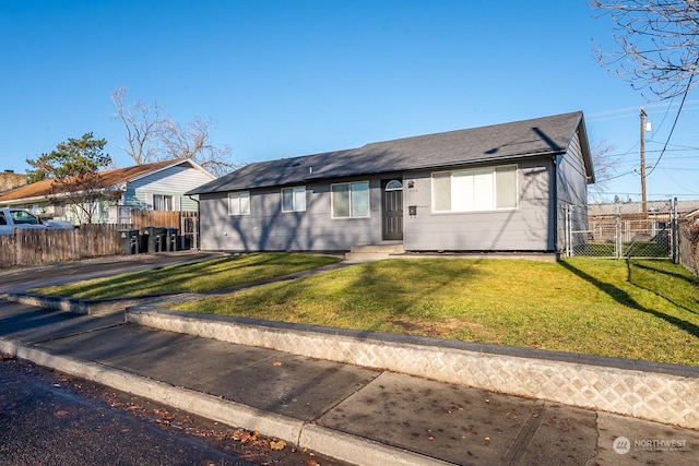 single story home featuring a front yard