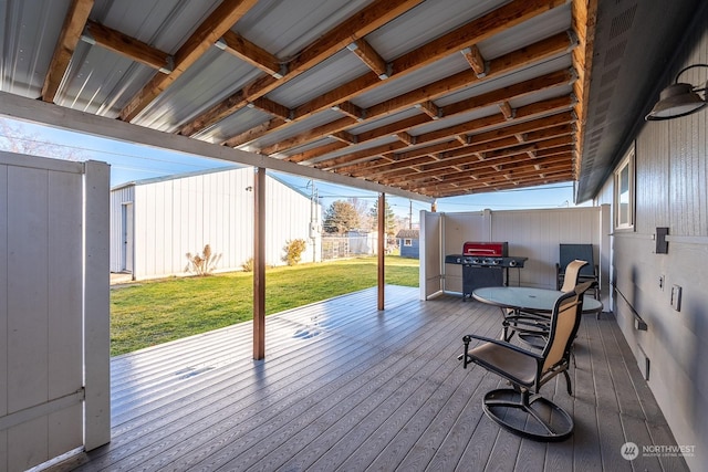 wooden deck featuring a yard