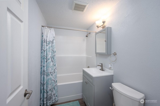 full bathroom with vanity, a textured ceiling, shower / tub combo with curtain, wood-type flooring, and toilet