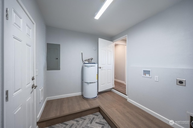 laundry room with secured water heater, electric panel, hardwood / wood-style flooring, washer hookup, and hookup for an electric dryer