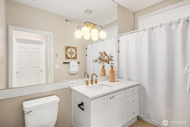 full bathroom featuring tile patterned floors, visible vents, toilet, and vanity