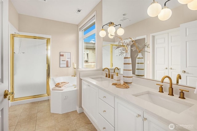 full bathroom featuring a bath, a stall shower, and a sink