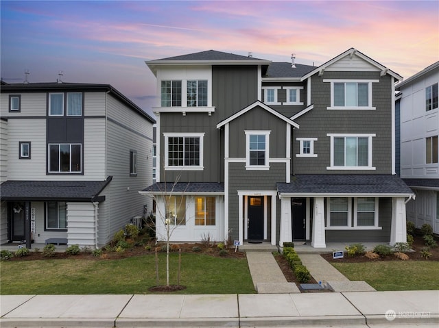 view of front of property with a yard