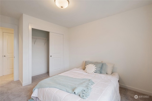 carpeted bedroom featuring a closet