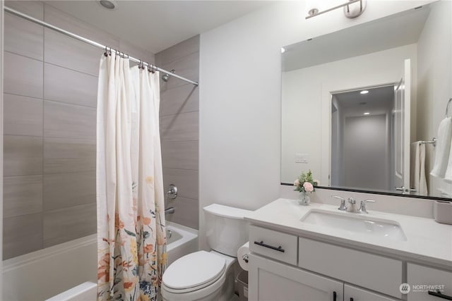 full bathroom with vanity, shower / bath combination with curtain, and toilet