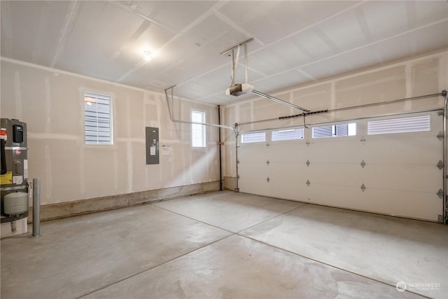 garage with electric panel and a garage door opener