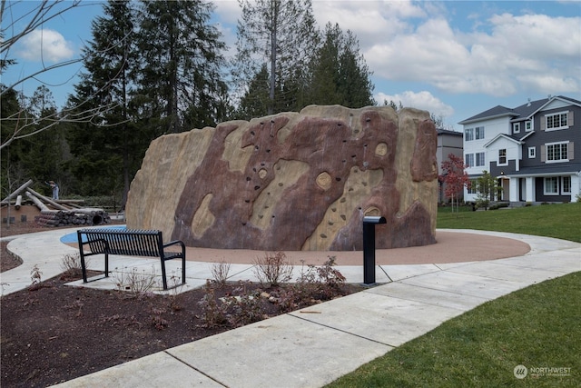 view of community featuring a lawn