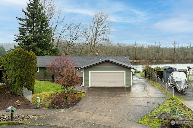 view of front of house featuring a water view and a garage