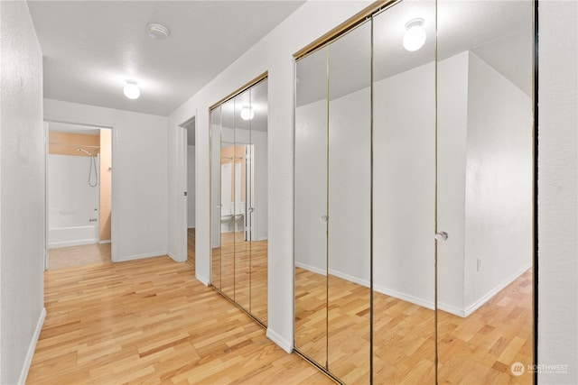 hallway featuring hardwood / wood-style flooring