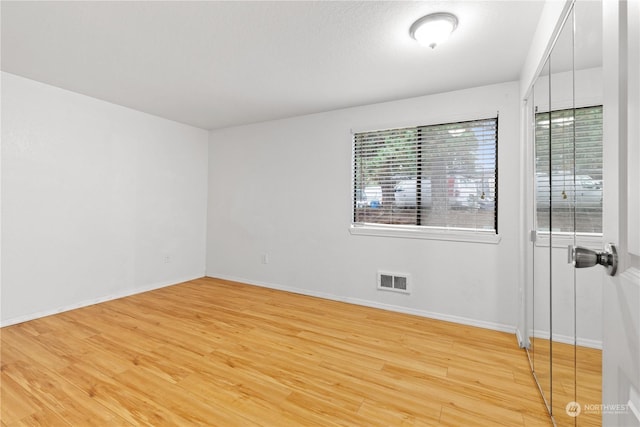 unfurnished room featuring light hardwood / wood-style flooring