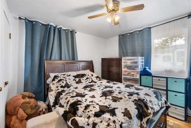 bedroom featuring hardwood / wood-style floors and ceiling fan