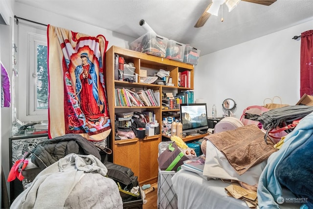 miscellaneous room featuring ceiling fan and hardwood / wood-style flooring