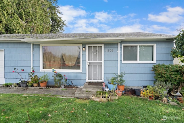 ranch-style house with a front yard