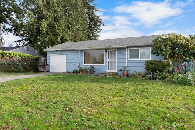 single story home with a front yard and a garage