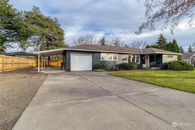 ranch-style home featuring a carport, a garage, and a front lawn