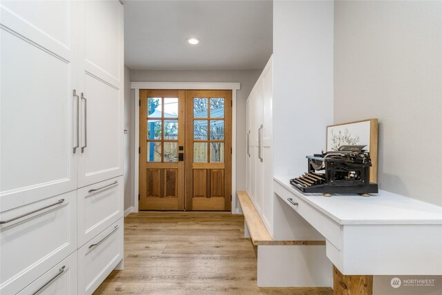 doorway to outside with french doors and light hardwood / wood-style floors