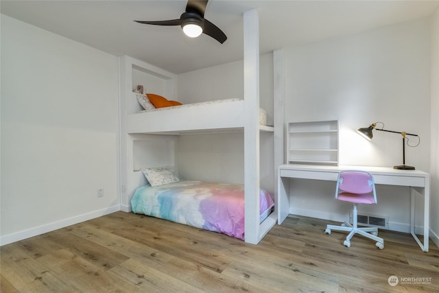 bedroom featuring ceiling fan and light hardwood / wood-style flooring