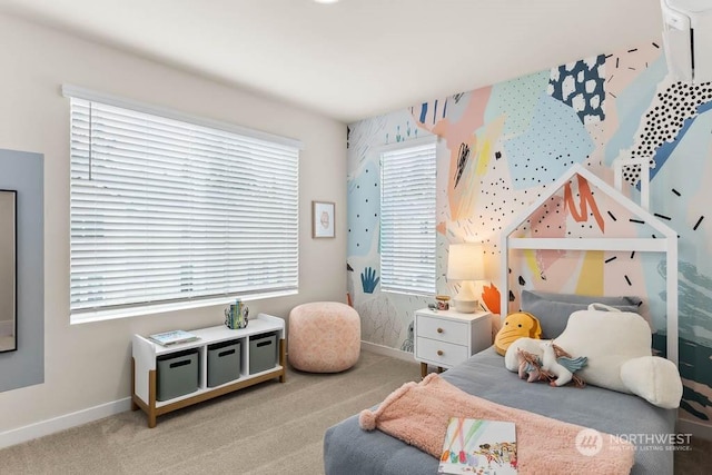 bedroom with carpet floors and multiple windows