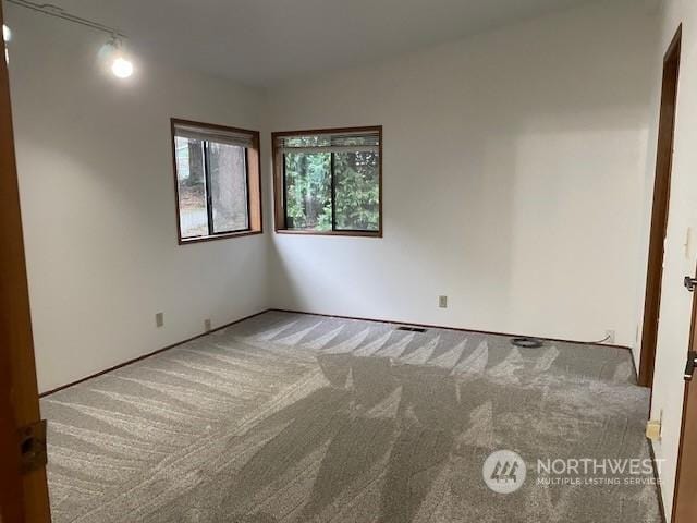 empty room featuring carpet floors