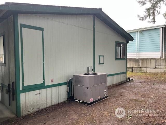 view of property exterior with central AC unit