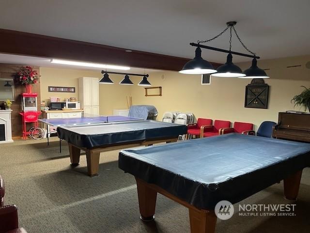 playroom featuring beam ceiling, carpet floors, and pool table