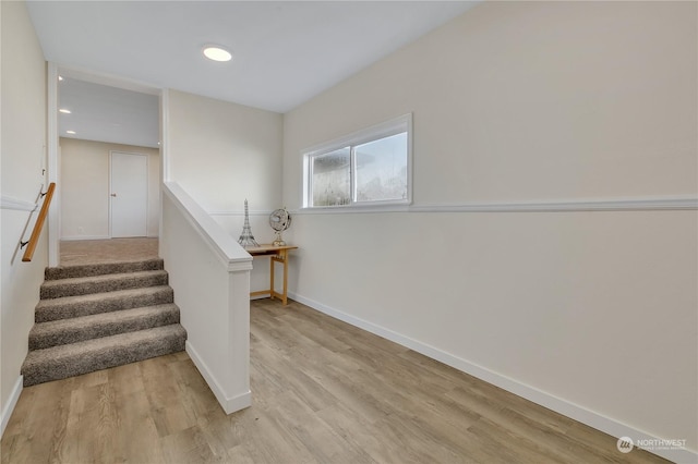 stairs with hardwood / wood-style floors