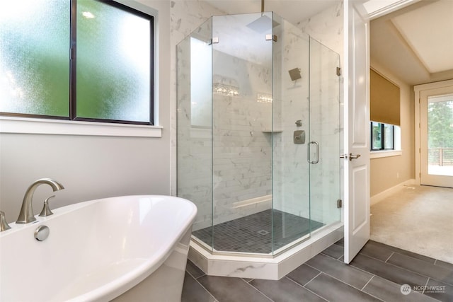 bathroom featuring sink and independent shower and bath