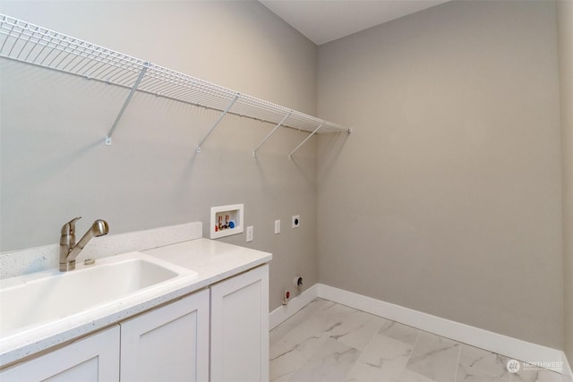 laundry room featuring hookup for an electric dryer, washer hookup, cabinets, gas dryer hookup, and sink