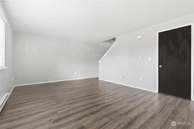 interior space with dark hardwood / wood-style flooring and a baseboard radiator