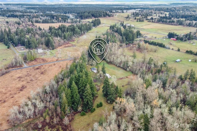 birds eye view of property with a rural view