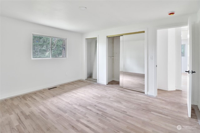 unfurnished bedroom with light hardwood / wood-style floors