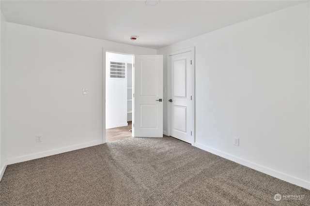 unfurnished room featuring carpet floors