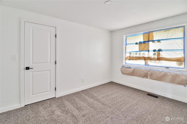 spare room with carpet flooring