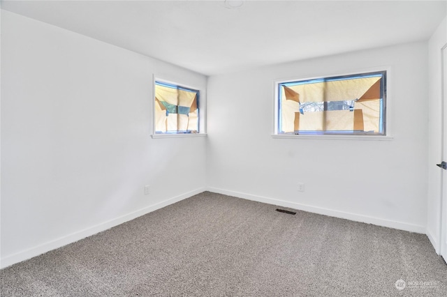 unfurnished room featuring carpet