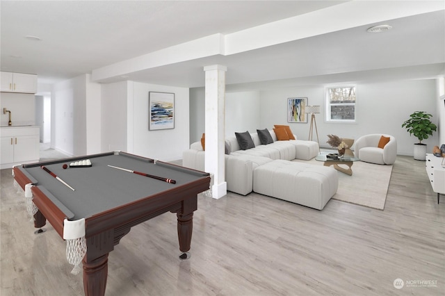 rec room with sink, light hardwood / wood-style flooring, and billiards