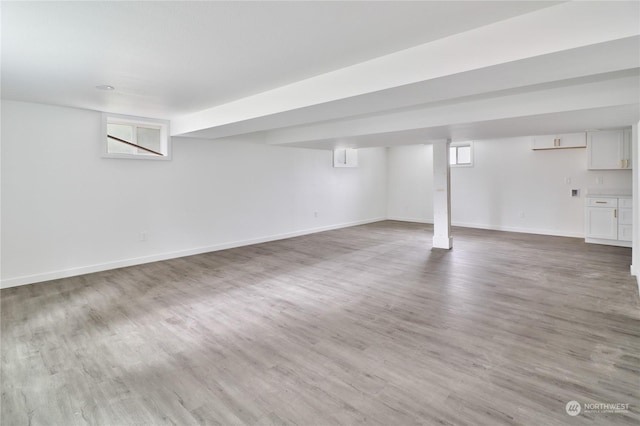 basement with wood-type flooring