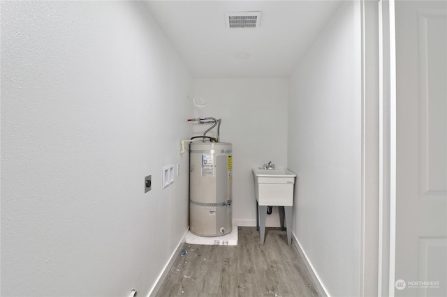 utility room with water heater