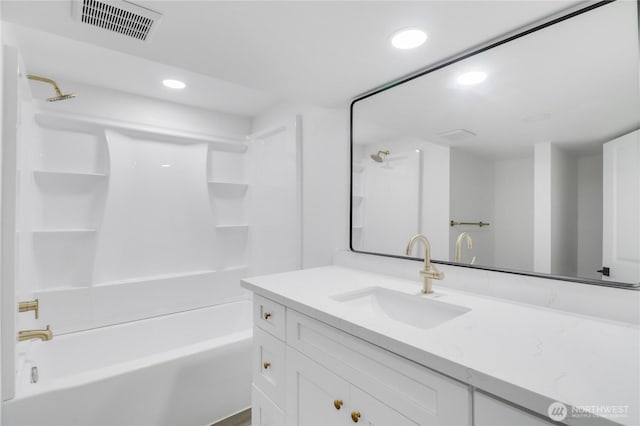 bathroom with recessed lighting, bathtub / shower combination, and vanity