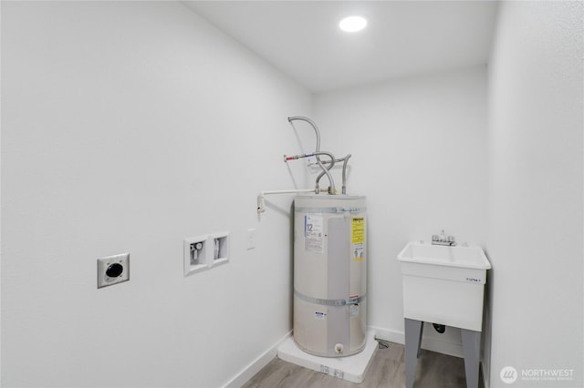 utility room featuring strapped water heater